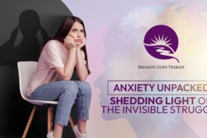 Child Sitting In A Chair With Their Elbows on Their Knees and Palms on Their Chin | Anxiety Unpacked: Shedding Light On The Invisible Struggle | Breaking Dawn Therapy